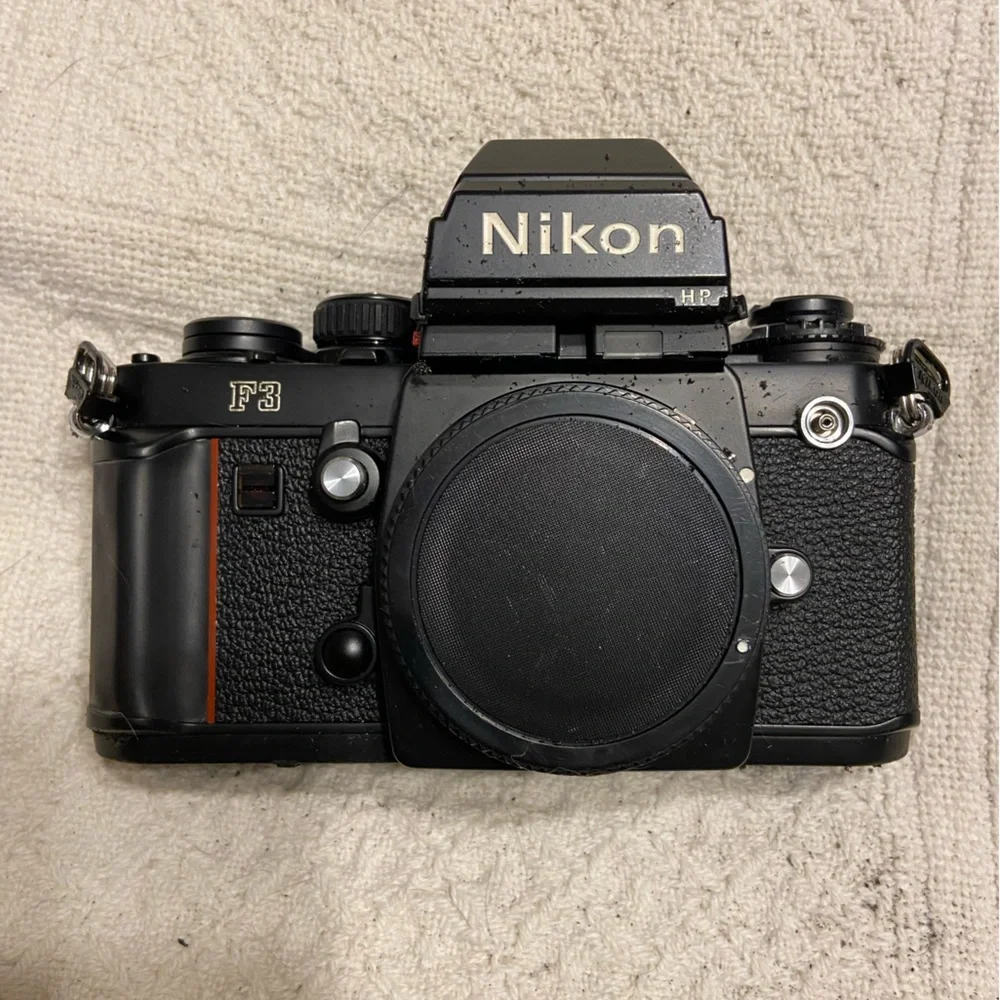 (2) Nikon F3 with Macro lens, light, zoom lens.